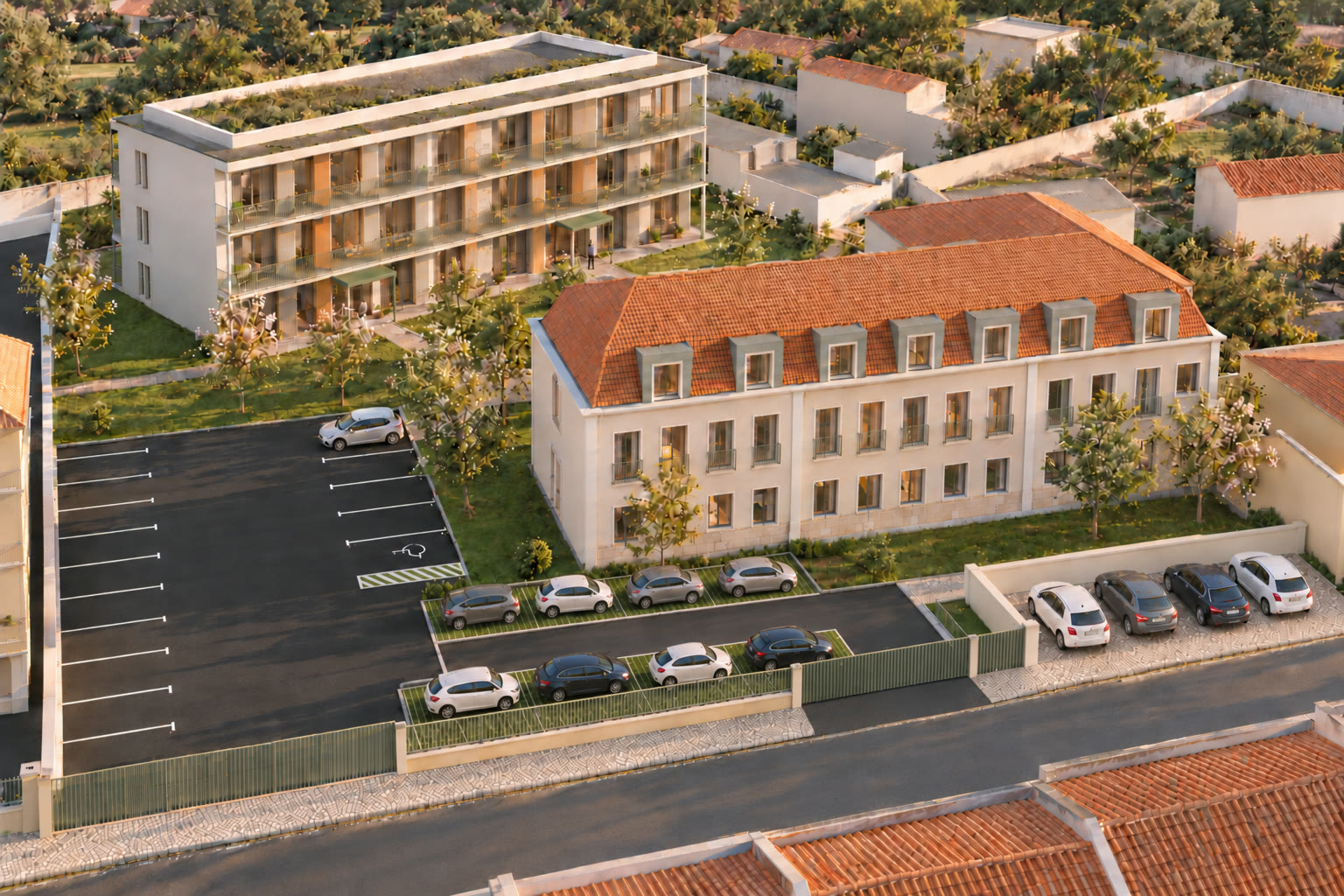 Vista aérea próxima do conjunto, com o edifício reabilitado da antiga escola em primeiro plano, o edifício novo por trás, o estacionamento e o muro com portão junto à rua